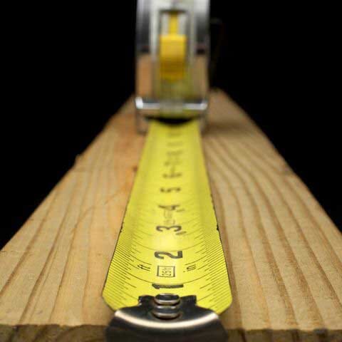 close up of a tape measure on a piece of timber